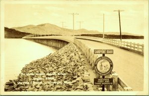 RPPC Lake Pend Oreille Bridge Sandpoint Idaho Biz Club Sign Real Photo Postcard