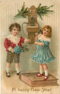 Children on Old Timey Telephone Embossed New Years Postcard 444/2 Stands On Book