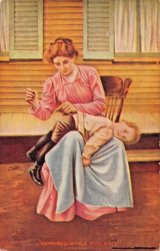 REPAIRED WHILE YOU WAIT-WOMAN SEWS HOLE IN YOUNG BOYS PANTS-COMIC POSTCARD 1910