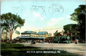 Postcard ME Waterville M. C. R. R. Depot Train Going Through Town Buggy 1909 M38