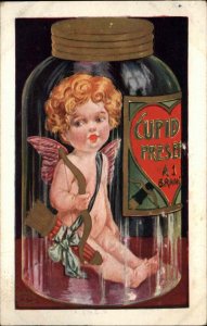 Fantasy Cupid in Giant Preserves Glass Jar Valentine #2362 c1910 Postcard