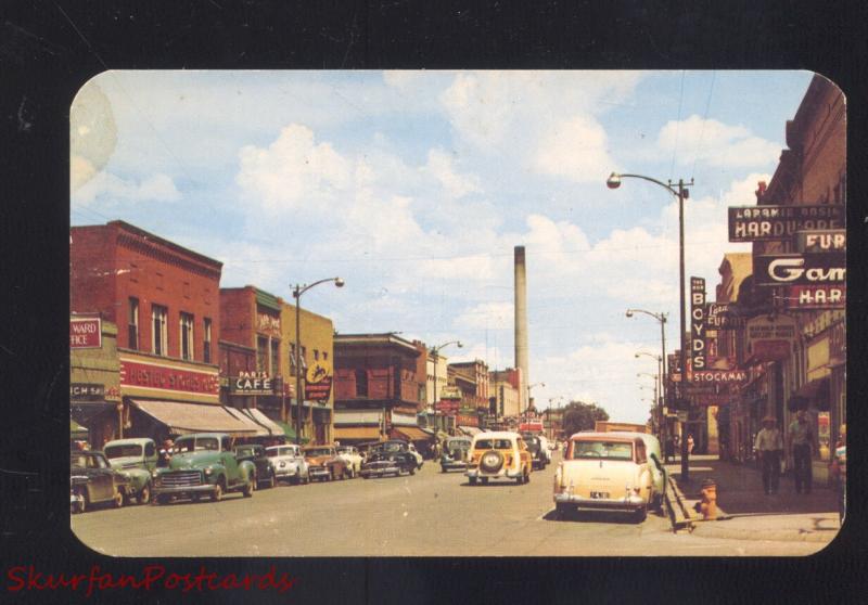 LARAMIE WYOMING DOWNTOWN SECOND STREET OLD CARS WOODY WAGON POSTCARD