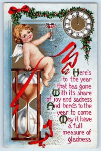 Christmas Postcard Angel On Top Of Hourglass Champagne Clock Holly Berries 1916