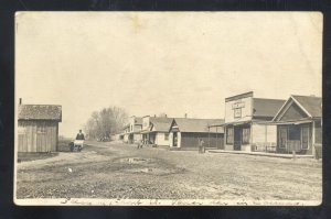 RPPC CARMAN ILLINOIS DOWNTOWN DIRT STREET SCENE 1916 REAL PHOTO POSTCARD