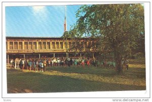 Flag lowering ceremony at sundown in front of dining hall, Memorial Camp, Mon...