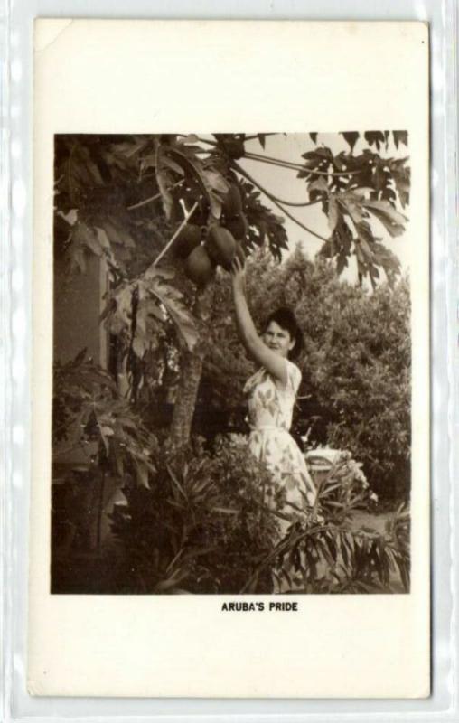 aruba, N.W.I., Girl picking Papaya Fruit Tree (1940s) RPPC