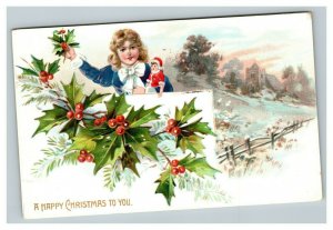 Vintage 1910 Tuck's Christmas Postcard - Cute Child with Xmas Doll Mistletoe