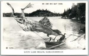 LOON LAKE BEACH SASK CANADA EXAGGERATED FISHING VINTAGE REAL PHOTO POSTCARD RPPC