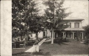 NEW PHILADELPHIA OHIO OH ?? 1910 CANCEL Setter Dog in Front of Home RPPC