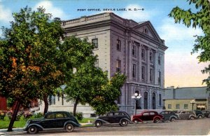 Devils Lake, North Dakota - Cars parked in front of the Post Office - c1940