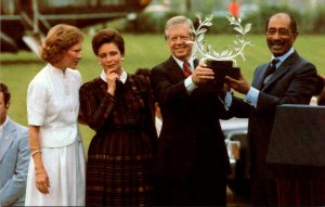 President Jimmy Carter Presenting A Laurel Wreath Symbolizing Peace To Anwar ...