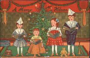 Christmas Children Singing Carols Chorus Books Toys c1910 Vintage Postcard