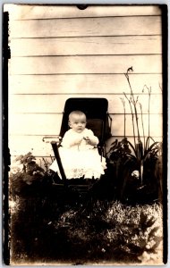 Infant Baby in White Dress Gown Sitting in Pull Wagon - Vintage Postcard