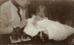 Baby Being Weighed Set of Scales Weights Danzig Cancel Real Photo Postcard