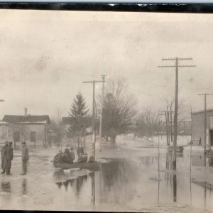 c1910s Unknown Flooded Town RPPC Real Photo PC Kids in Boat Kismet Tobacco A111