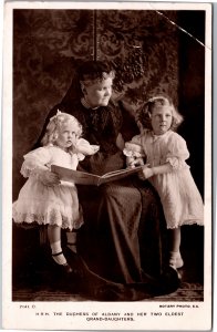 Duchess of Albany and two eldest grandaughters reading a book