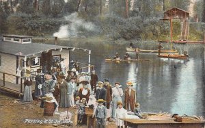 PICNICING AT ST. JOE IDAHO HOUSE BOAT POSTCARD (c. 1910)