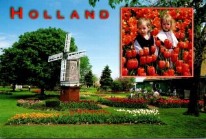 Michigan Holland Windmill and Tulips With Kids In Dutch Costumes At Veldheer&...