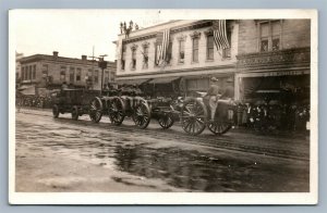 US CAVALRY STREET SCENE w/ AMERICAN FLAGS ANTIQUE REAL PHOTO POSTCARD RPPC