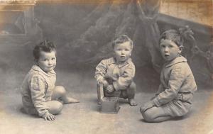 3 Little boys playing Child, People Photo Writing on back 