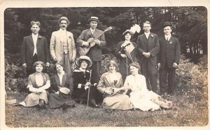 Men and women sitting in a field Adults & Children Unused 