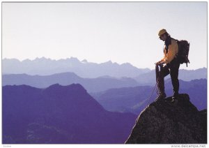Man on top of mountain , Canada , 1990s