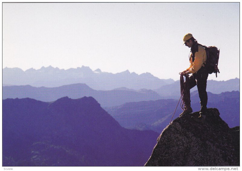 Man on top of mountain , Canada , 1990s