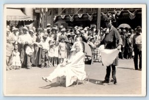 Klamath Falls OR Postcard RPPC Photo Man With Milk Bottle Baby Carriage Parade