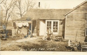 c1910 RPPC Bill & the Pups, Boy w/ Tall Hunting Hound Dogs by House, Unknown US