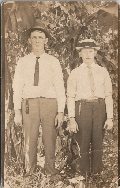 RPPC Two Handsome Men Posing in the Tree Watch Fob Ribbon c1910 Postcard W7