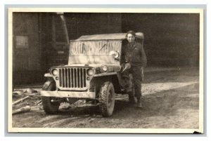 Vintage 1940's Postcard US Army Soldier Poses Next to Jeep in German Town