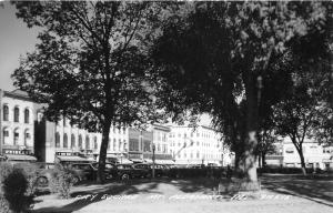 Mt Pleasant Iowa~City Square~Classic Cars Parked in Shade~Stores~1950s RPPC