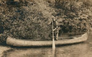 AMERICAN INDIAN GIRL IN CANOE ANTIQUE REAL PHOTO POSTCARD RPPC