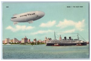 c1950's Good Year Air Dirigible Steamboat Steamship Busy Port Miami FL Postcard