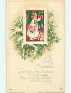 Unused Divided-Back christmas GIRL WITH DOLL DECORATES THE XMAS TREE r4471