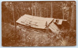 RPPC CANADA? ~ LOG CABIN Falling Down in the WOODS MAN on ROOF c1910s  Postcard