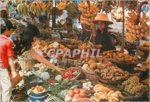 CPM An inviting array of luscient tropical fruits and vegetables shoppers at the