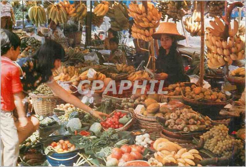 CPM An inviting array of luscient tropical fruits and vegetables shoppers at the