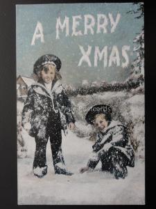 A MERRY XMAS - TWO CHILDREN PLAYING IN THE SNOW c1905 Postcard by Valentine