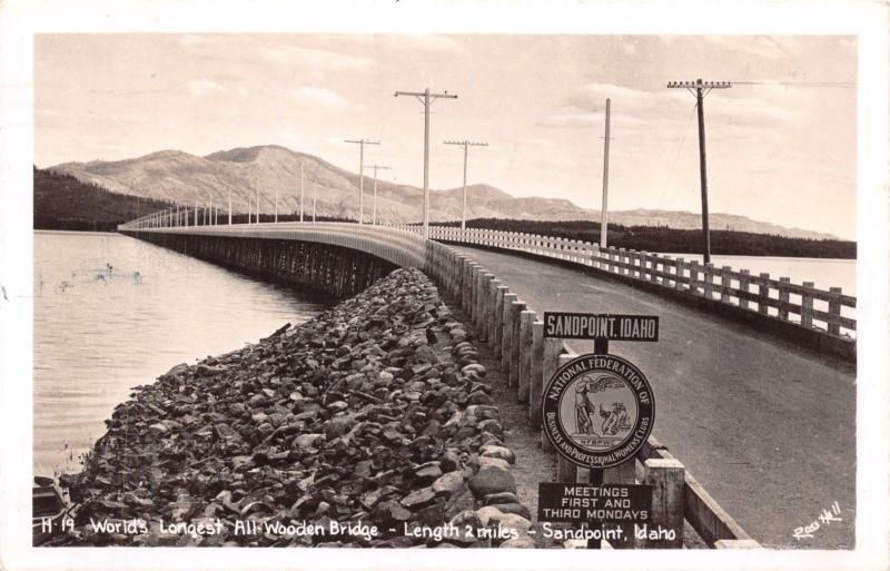 SANDPOINT ID WORLDS LONGEST ALL WOODEN BRIDGE~REAL PHOTO POSTCARD 1947 BPW SIGN