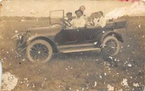 Taiton Texas c1910 RPPC Real Photo Postcard Family In An Automobile Dog Field