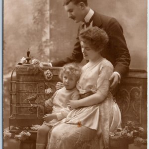 c1910s Beautiful European Family RPPC Girl Bird Cage Girl Staged Photo PC A149