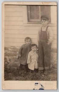 RPPC Cute Boy Overalls Cap Railroad Farmer Little Brothers in Grass Postcard E30