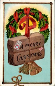 A Merry Christmas package, wreath, gold bells Th EL Theochrom 1245 Postcard 1912