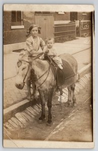 RPPC Sidewalk Photo With Donkey And Girls Ardell Holds Irene c1910 Postcard Q22