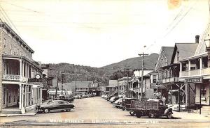 Groveton NH Street View Storefronts IGA Eagle Hotel Old Cars Truck RPPC Postcard