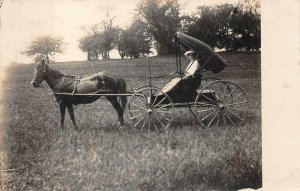RPPC WOMAN IN UNUSUAL HORSE CARRIAGE REAL PHOTO POSTCARD (c. 1920)