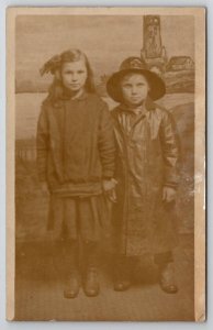 RPPC Cute Kids Boy In Raincoat Seaside Lighthouse Studio Backdrop Postcard Q22