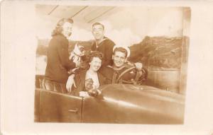 UNITED STATES SAILORS & GIRLS POSE STAGED AUTOMOBILE REAL PHOTO POSTCARD c1940s