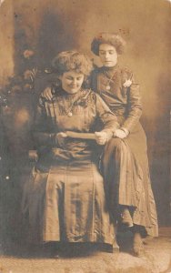 RPPC WOMEN READING A LETTER CONNEAUT OHIO STUDIO REAL PHOTO POSTCARD (c. 1910)